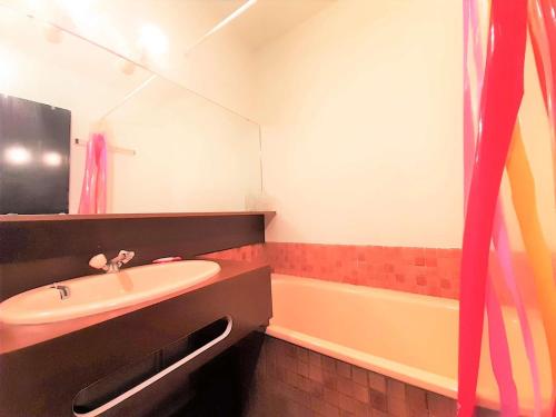 a bathroom with a sink and a bath tub at Studio Cabine 6 Pers. Avec Ascenseur et Casier à Ski - Piau-Engaly - FR-1-457-313 in Aragnouet