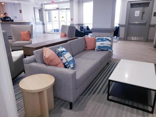 a living room with a couch and a table at Comfort Suites Valdosta Mall Area in Valdosta
