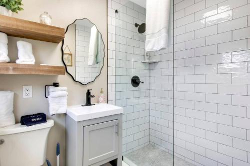 a white bathroom with a sink and a shower at New Studio Apartment w Kitchen - A in West Palm Beach