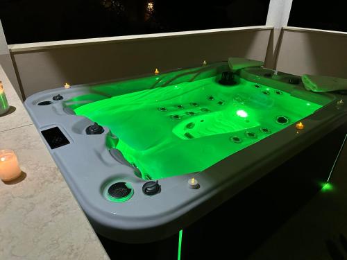 a bath tub with a green liquid inside of it at Villa KRK-4 bedrooms, 4 bathrooms with heated pool and jacuzzi, 150m from the sea in Krk