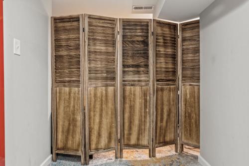 a room with wooden closet systems at Uptown Gem! 2Luxe King Suites - 5 Smart TV's - Parking in Philadelphia