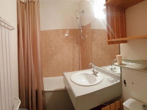 a bathroom with a sink and a shower at Studio La Plagne Montalbert , 1 pièce, 3 personnes - FR-1-181-2544 in Aime-La Plagne