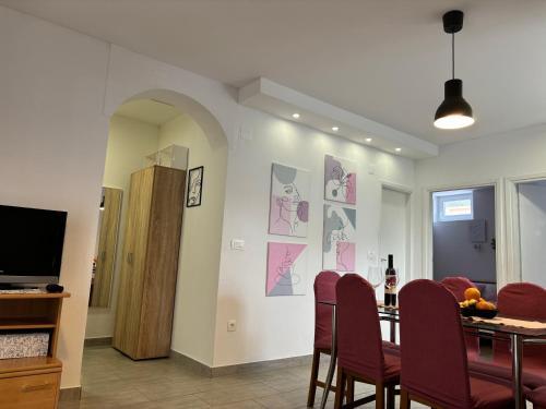 a dining room with a table and chairs at City Center Suite Novalja in Novalja