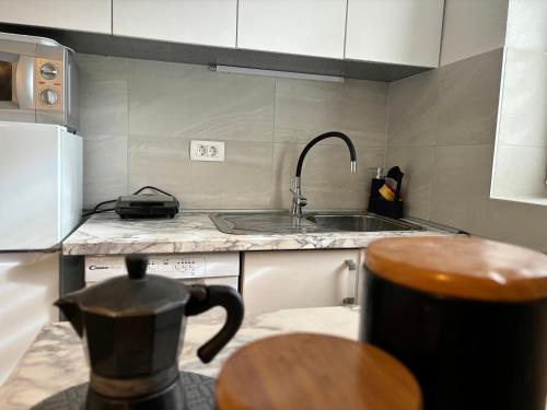 a kitchen with a coffee cup on a table at City Center Suite Novalja in Novalja