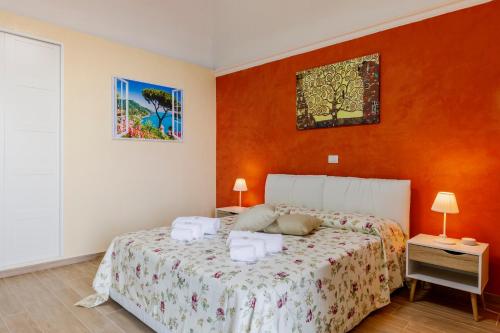 a bedroom with a bed with two towels on it at La Piccola Atrani in Atrani