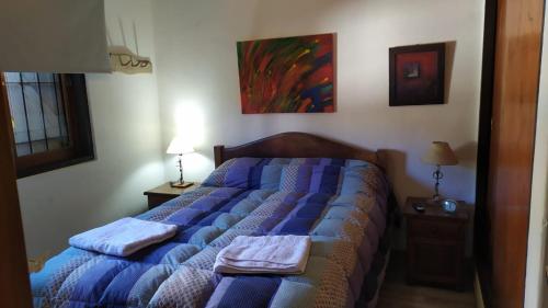 En eller flere senge i et værelse på Alojamiento Nestor Tacuari