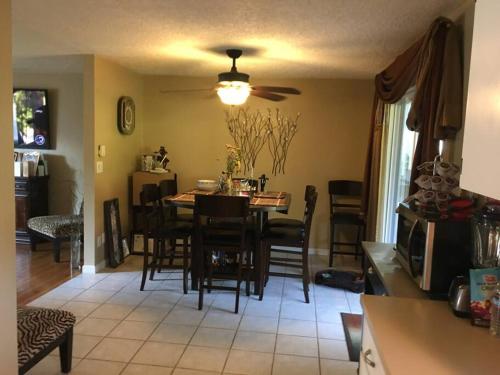 a kitchen and dining room with a table and chairs at West Linn Relaxing Entire Home WiFi TV Yard BBQ Eateries in West Linn