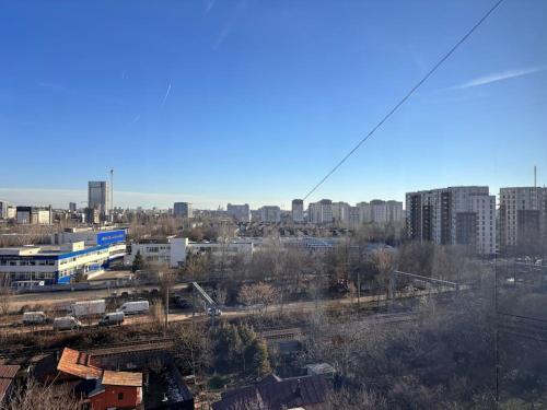 a view of a city with buildings in the background at Apartament 2 camere Sector 1 in Bucharest