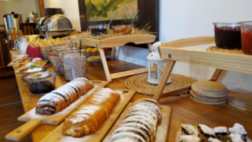 a table topped with different types of pastries at Penzion Zvonička in Pec pod Sněžkou