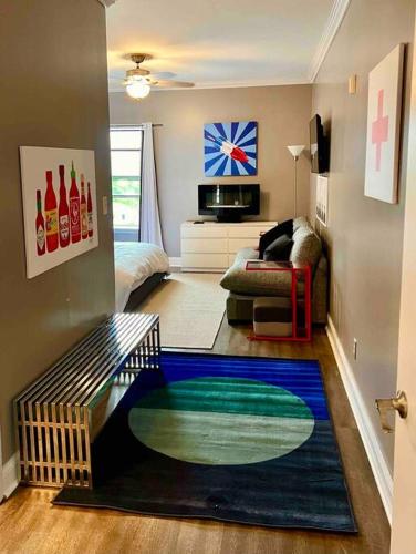 a living room with a pool in the middle of the floor at Coolest condo ever- Indy's best at your door step - Central Mass Ave! in Indianapolis