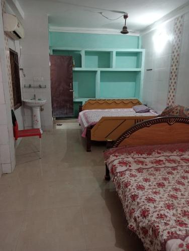 Postelja oz. postelje v sobi nastanitve WeKare Puri Temple Front, Near Jagannath Temple