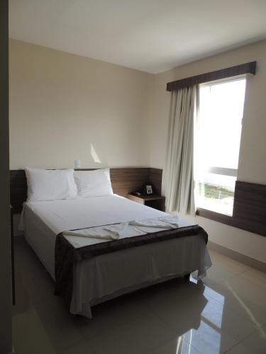 Ένα ή περισσότερα κρεβάτια σε δωμάτιο στο Hotel Belugi