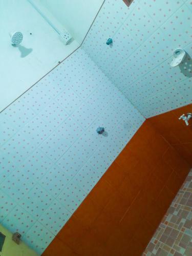 a white ceiling with polka dots on it at Hill House Haldummulla in Badulla