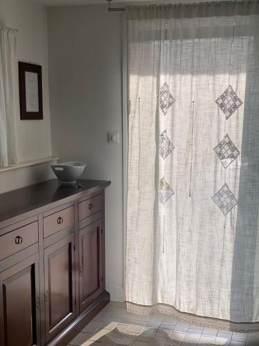 a bathroom with a shower curtain and a sink at Stella House in Crevalcore