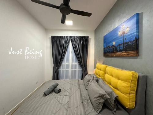 a bedroom with a bed and a ceiling fan at JBH Family Suite for 6pax King/Queen/Single/Sofa in Kuala Lumpur