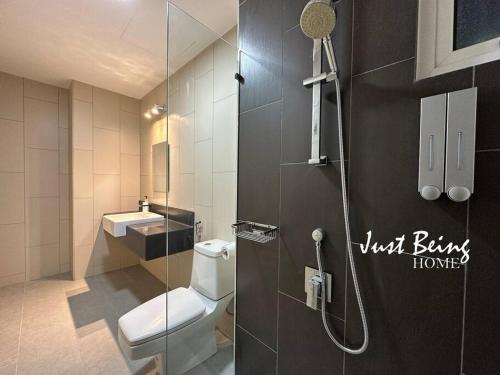 a bathroom with a shower and a toilet and a sink at JBH Family Suite for 6pax King/Queen/Single/Sofa in Kuala Lumpur