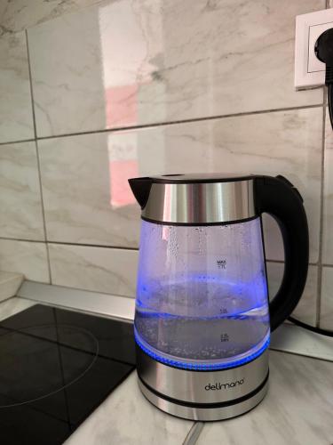a coffee pot sitting on top of a counter at Sea Apartment Igalo in Herceg-Novi