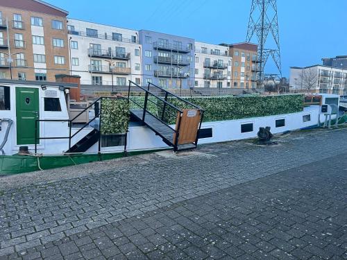 a staircase on a boat on a city street at Judith Barge in Colchester