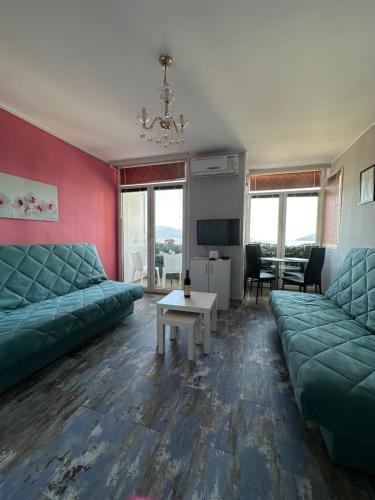 a living room with a couch and a table at Sea Apartment Igalo in Herceg-Novi