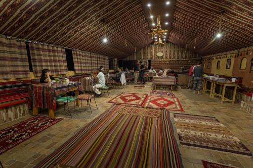 a large room with many carpets on the floor at Wadi Rum Trip in Wadi Rum