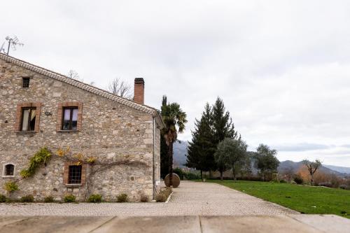 an old stone building with a pathway next to it at Masseria boutique b&b in Montella