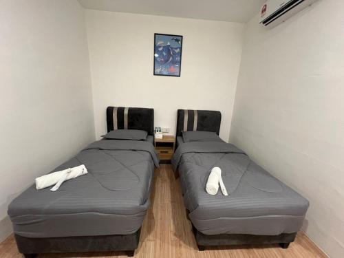 Postel nebo postele na pokoji v ubytování KIWI INN