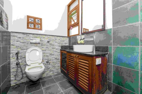 a bathroom with a toilet and a sink at Jugglers Rest Hostel Bangalore in Bangalore