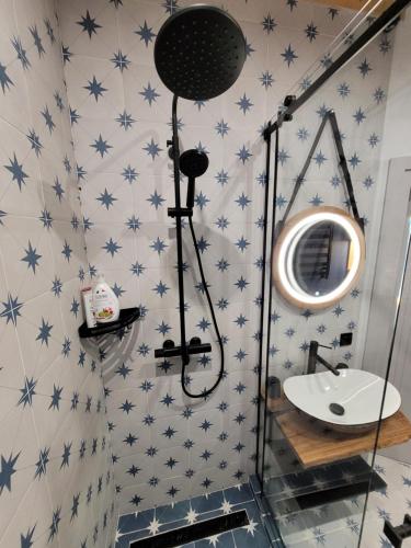 a bathroom with blue stars on the wall at Шале Green Land in Bukovel