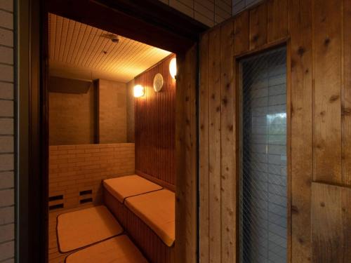 a room with a sauna with a window at HILLTOP RESORT FUKUOKA - Former Agora Fukuoka Hilltop Hotel & Spa in Fukuoka