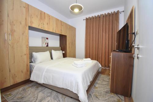 Urbanin Apartment A4 tesisinde bir odada yatak veya yataklar