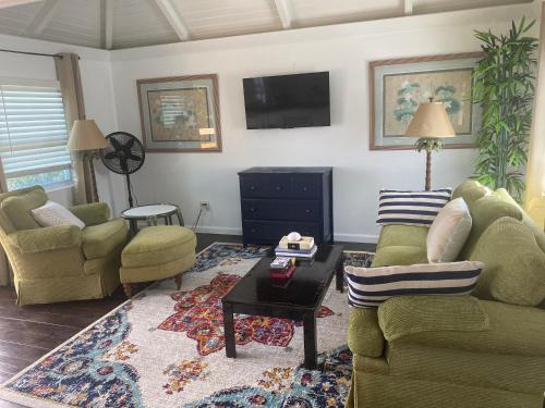 a living room with two couches and a coffee table at Estate Lowry Hill in Christiansted
