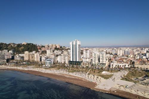 an aerial view of a city with a beach and buildings at Grandstay Apartments in Durrës
