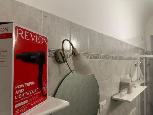 a bathroom with a shower with a toilet paper dispenser at [2 passi dal mare di Alassio] Ampio trilocale in Alassio