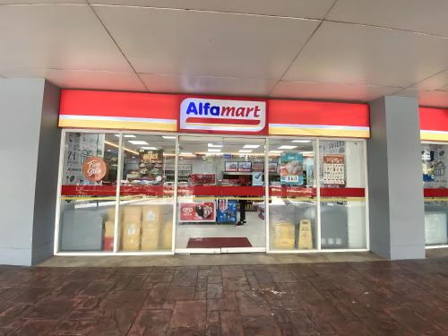 an air mart store with a sign on the front of it at Condo Unit near MOA, PICC, US Embassy and Airport in Manila