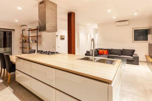 a kitchen with a sink and a counter top at Modern 3 BED & 2 BTH APT Sliema in Sliema