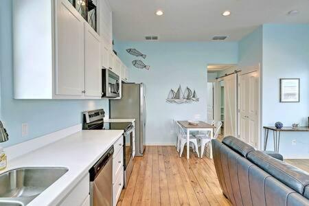 a kitchen with a sink and a counter top at Mary Lou's Hideout (11th St Bungalows #19) in Port Aransas