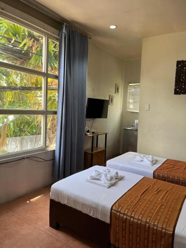 Postel nebo postele na pokoji v ubytování Boracay Ocean Bay Hotel
