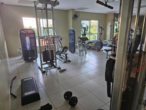 a gym with several treadmills and machines in a room at Ecologic Ville Resort Apto há 900 mt do centro de Caldas Novas in Caldas Novas
