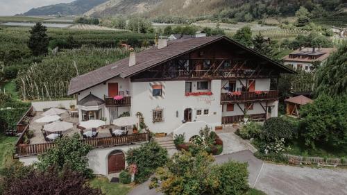 an aerial view of a house in a valley at Feldgärtenhof in Silandro