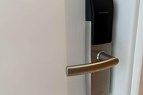 a close up of a refrigerator door with a handle at Studios Premium RN in Maceió