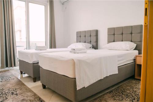Postel nebo postele na pokoji v ubytování Apartments Casa Mia