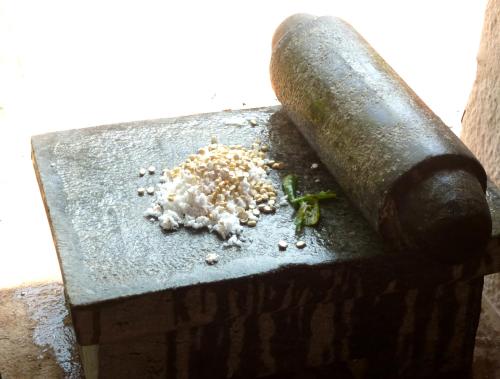 a block with a pile of food on it at Saratha Vilas Chettinad in Kānādukāttān