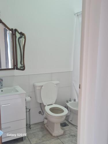 a white bathroom with a toilet and a sink at Loft San Francisco, Cordoba in San Francisco