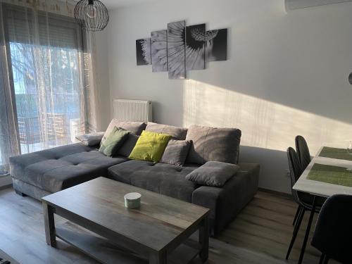 a living room with a couch and a coffee table at Edison Villa 204 in Fonyód