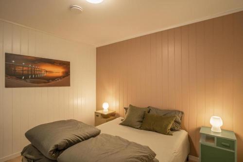 Ένα ή περισσότερα κρεβάτια σε δωμάτιο στο Secluded northern light apartment with great view!