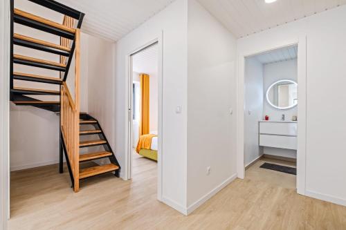 a room with a staircase and a bedroom at AGUIAR´S VILLAGE in Ribeira Brava