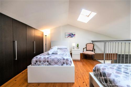 Кровать или кровати в номере Casa Mia ,APT WiFi e Parcheggio nel cuore del Friuli