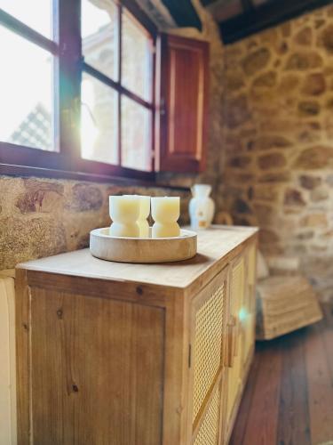 a table with two candles on top of it at B&B La Vista Brava in Platja  d'Aro