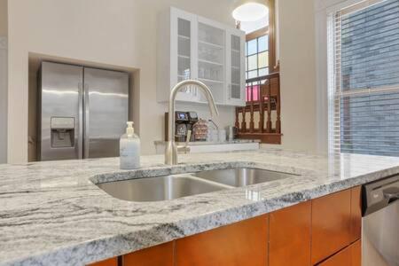 a kitchen with a sink and a counter top at Historic Elegance Retreat - Columbus Downtown in Columbus