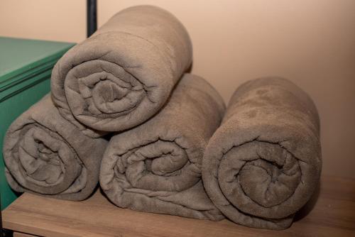 a pile of towels sitting on top of a table at Porteño Loft Búzios in Búzios